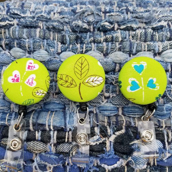 Plant and heart badge reels for work or school IDs