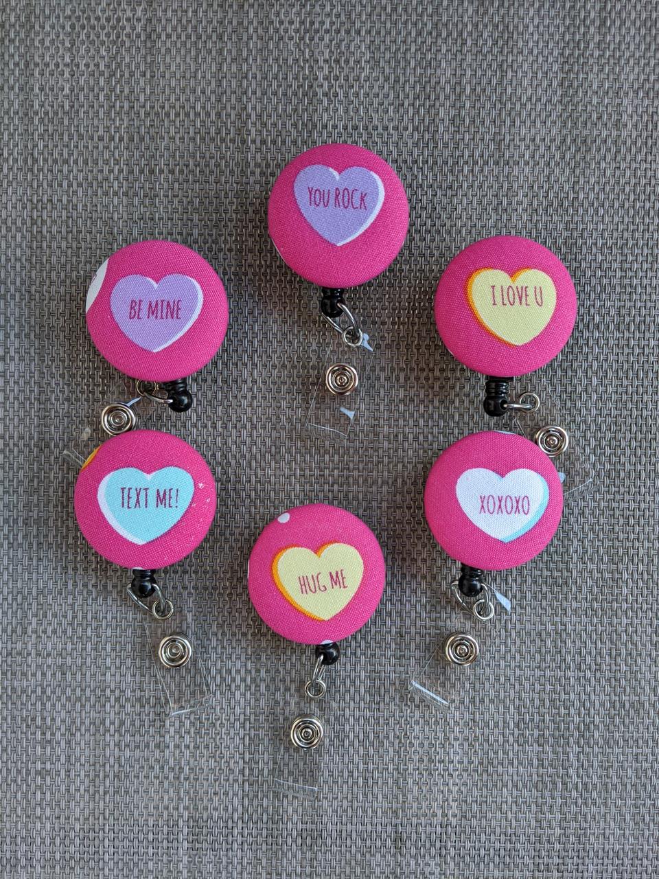 Conversation heart badge reels for work or school.