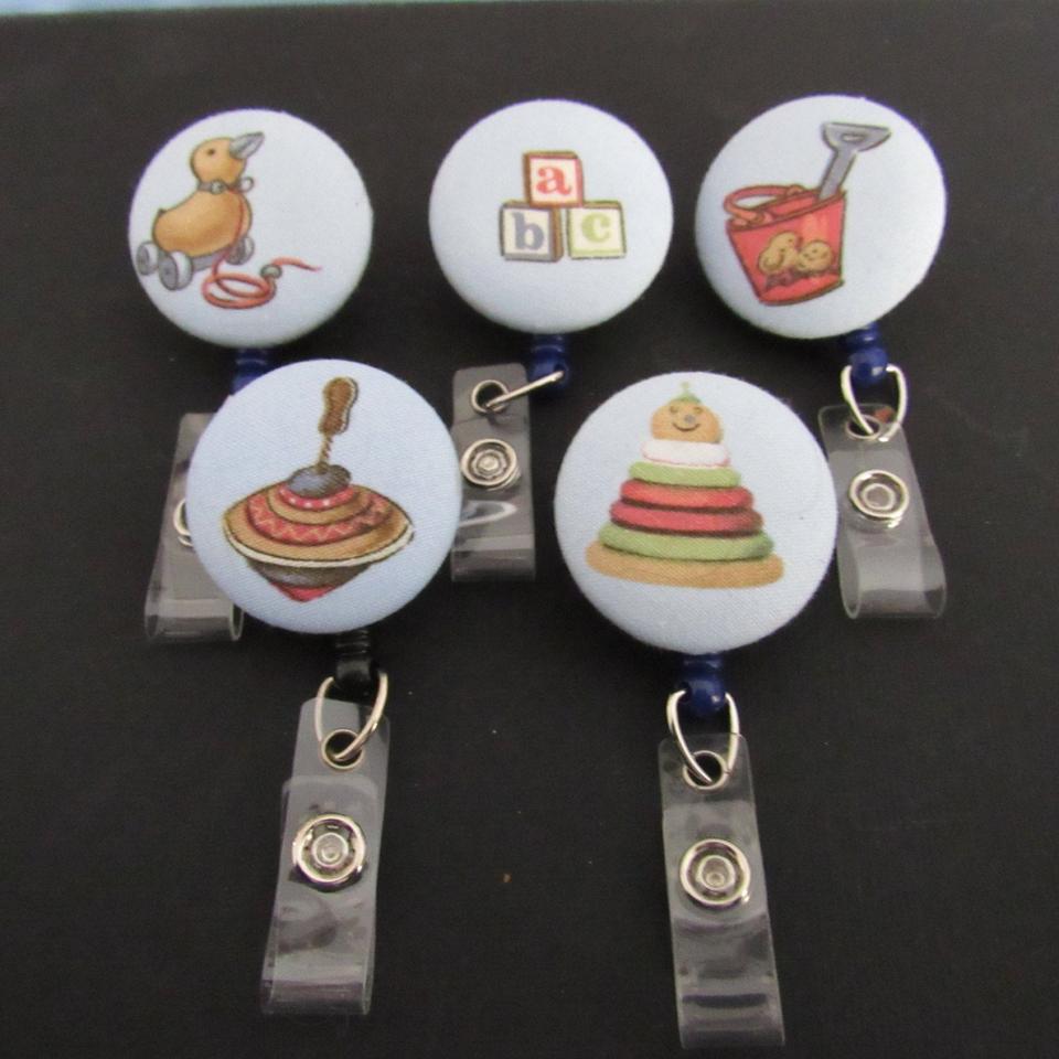 Vintage toy badge reel