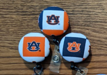 Illinois and Auburn badge reels