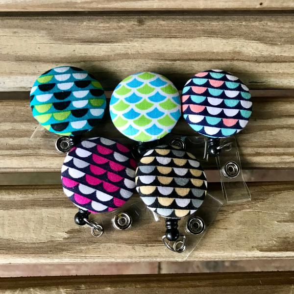 Mermaid or scallop design badge reels for work or school IDs